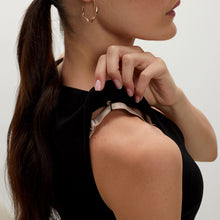 Detail image of a woman standing wearing the Rachel dress in black
