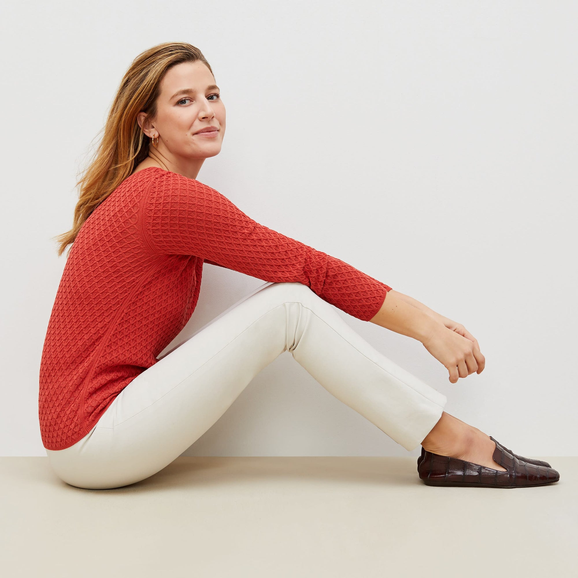 Side image of a woman standing wearing the foster pant in bone | Exclude