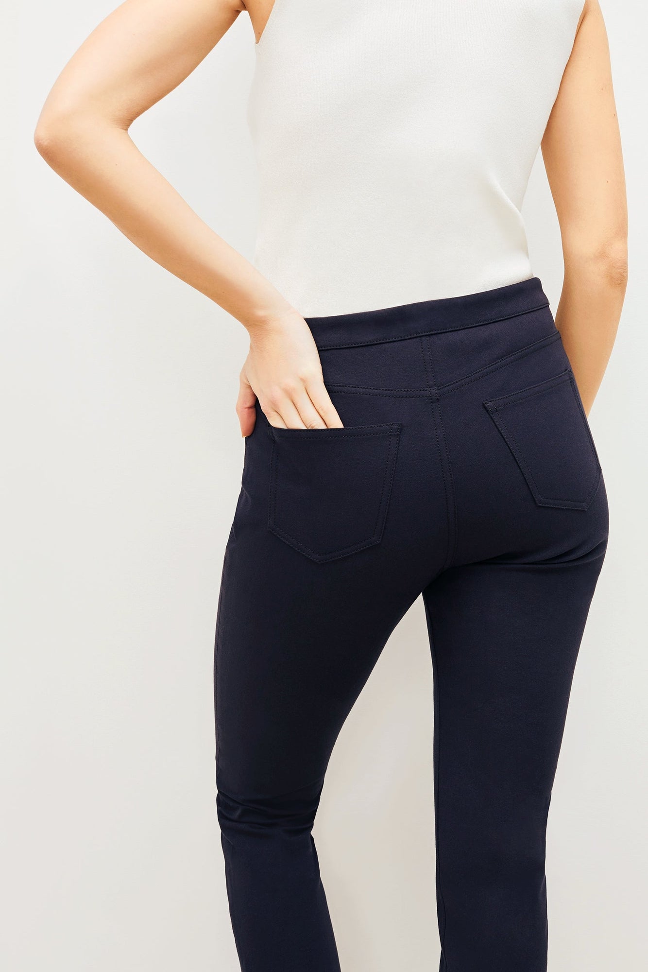 Front image of a woman standing wearing the Hockley pant in ink | Exclude