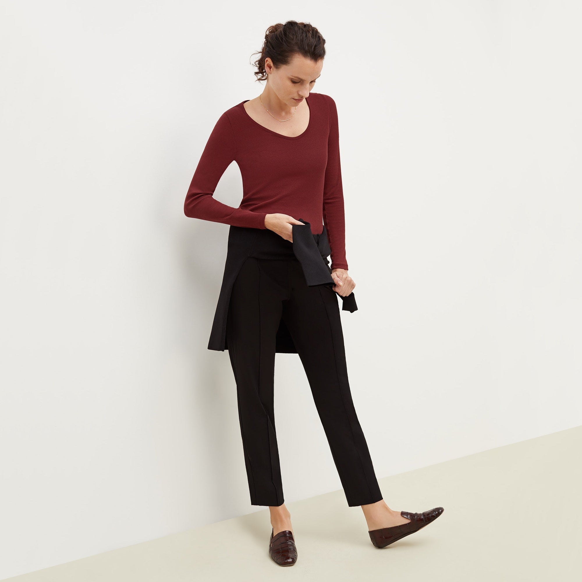 Front image of a woman standing wearing the Colby Jogger in Black | Exclude