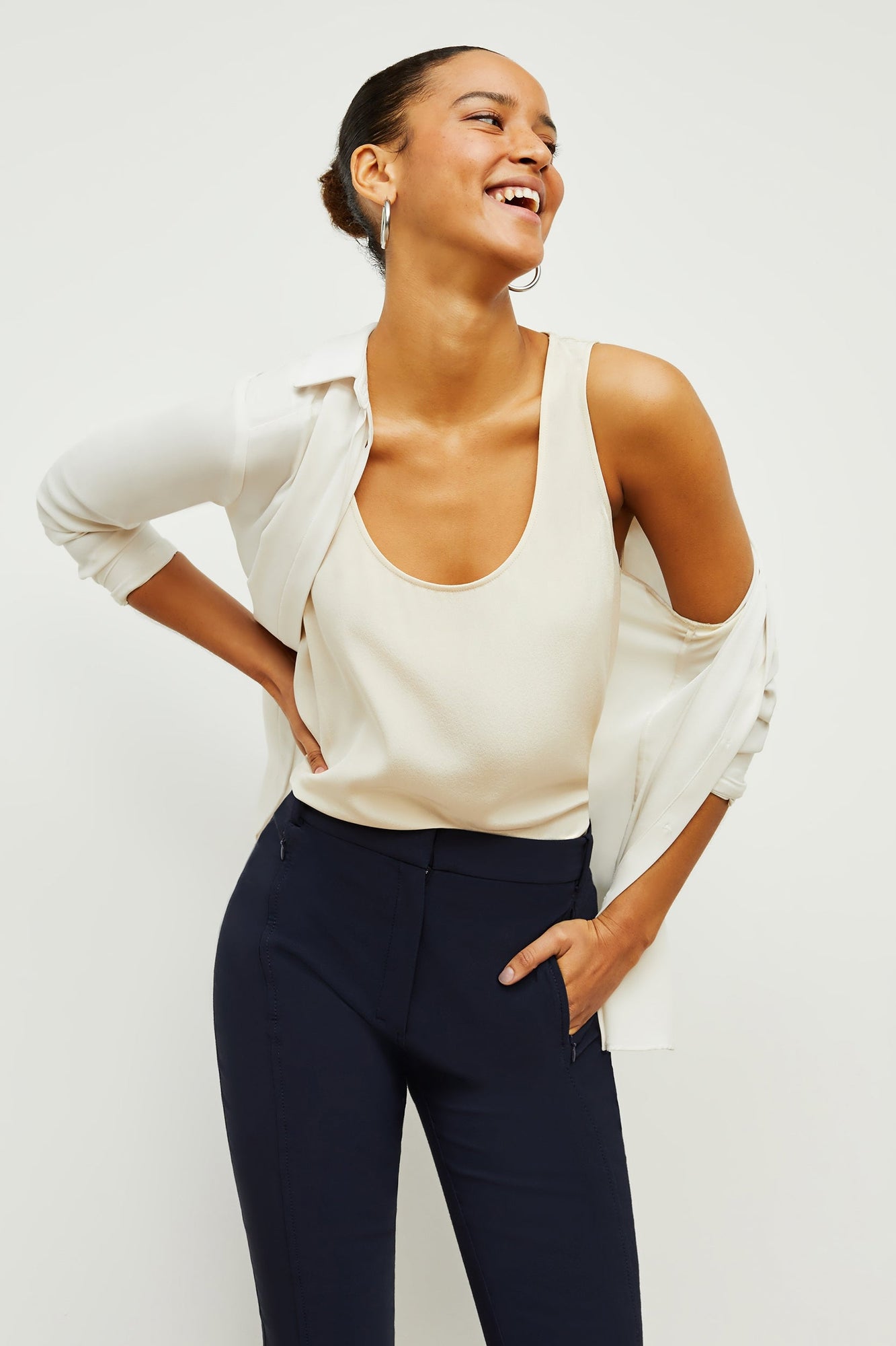 Front image of a woman standing wearing the Vicky Tank—Washable Silk in Pearl | Exclude | Grid