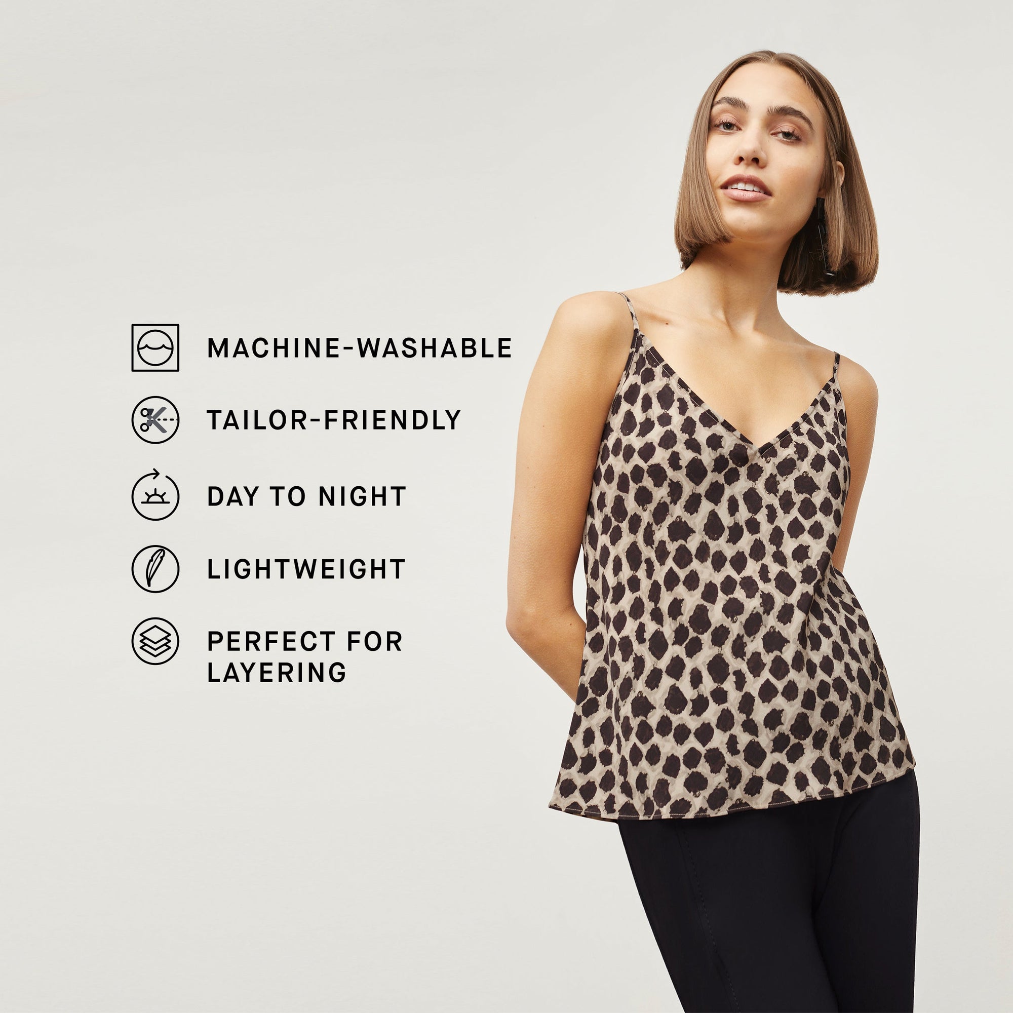 Front image of a woman standing wearing the Lisey Cami—Sahara Print Washable Silk in Tan/Black | Exclude