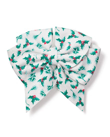 The Girls Hair Bows in Sprigs of the Season by Petite Plume is a decorative bow made of white fabric with green holly leaves and red berries. This classic-shaped accessory features looping folds and long tails, perfect for holiday decor or as a festive touch to gifts.