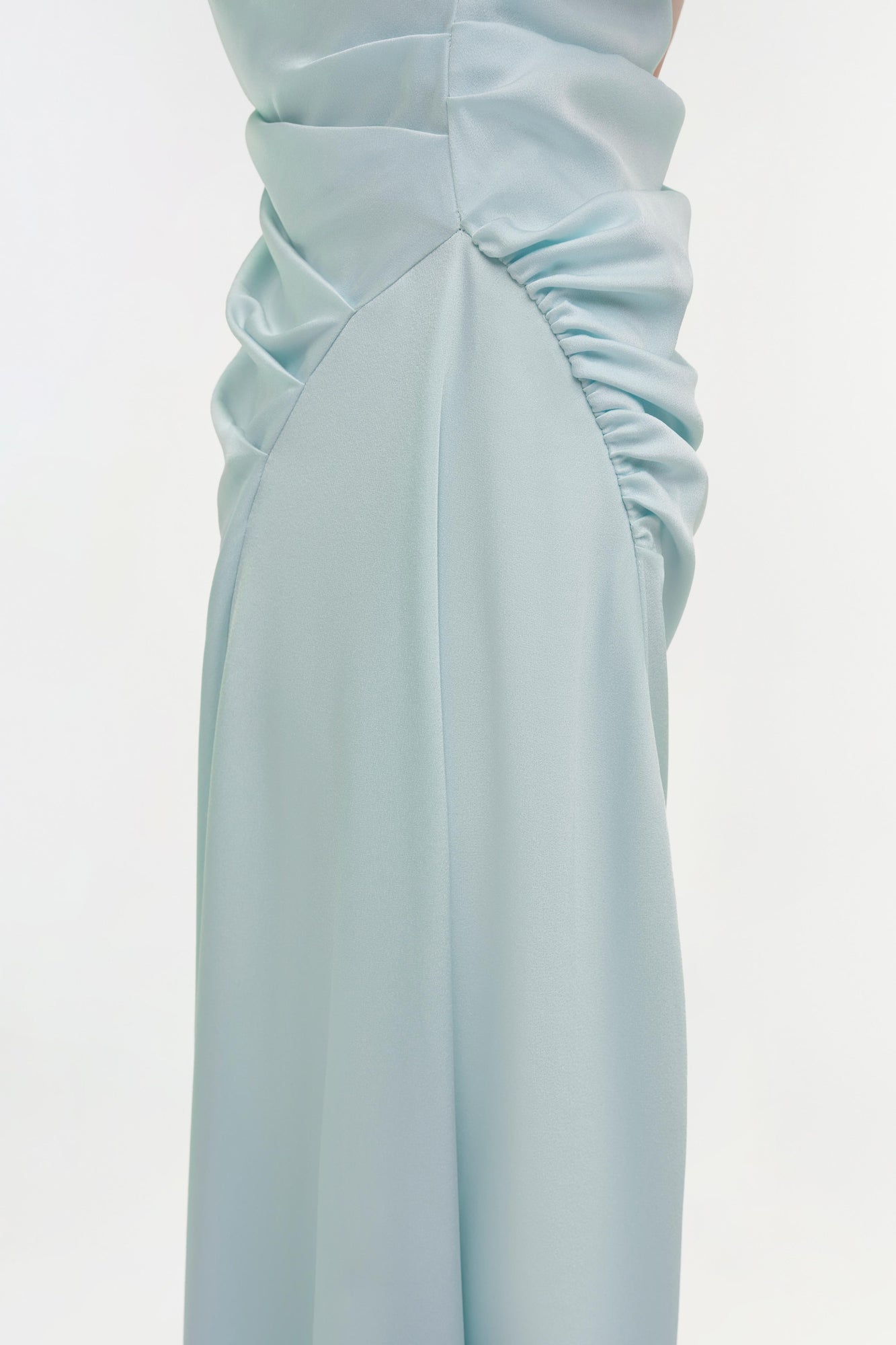 Light blue satin midi dress with draped ruching on the bodice and side, shown from waist down.