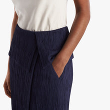 Detail image of the pocket of the Montgomery skirt in aegean blue.
