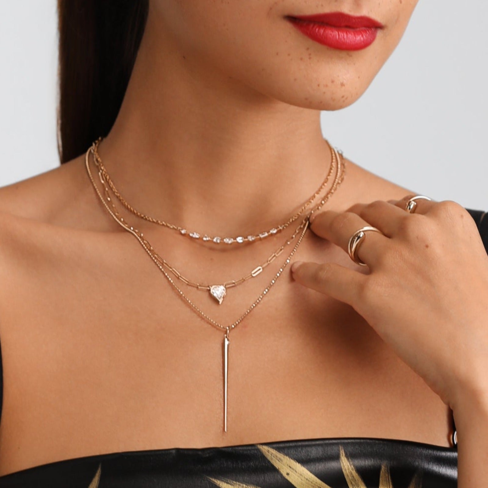 14K Recycled Gold Quill Spike Charm with Diamond layered on a diamond cut bead chain styled with multiple diamond chains