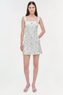 White embellished jacquard mini dress with square neckline, sleeveless design, and side pocket.