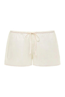 Cream low-rise drawstring shorts with raspberry pink trim stitching and tie waist.