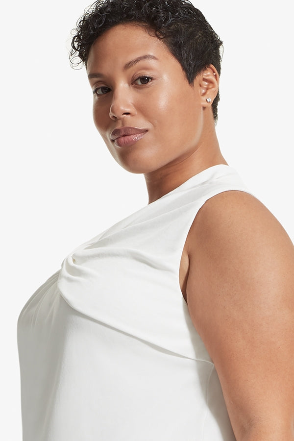 Side image of a woman standing wearing the Walters top knit crepe in Ivory | Plus Hover | Exclude