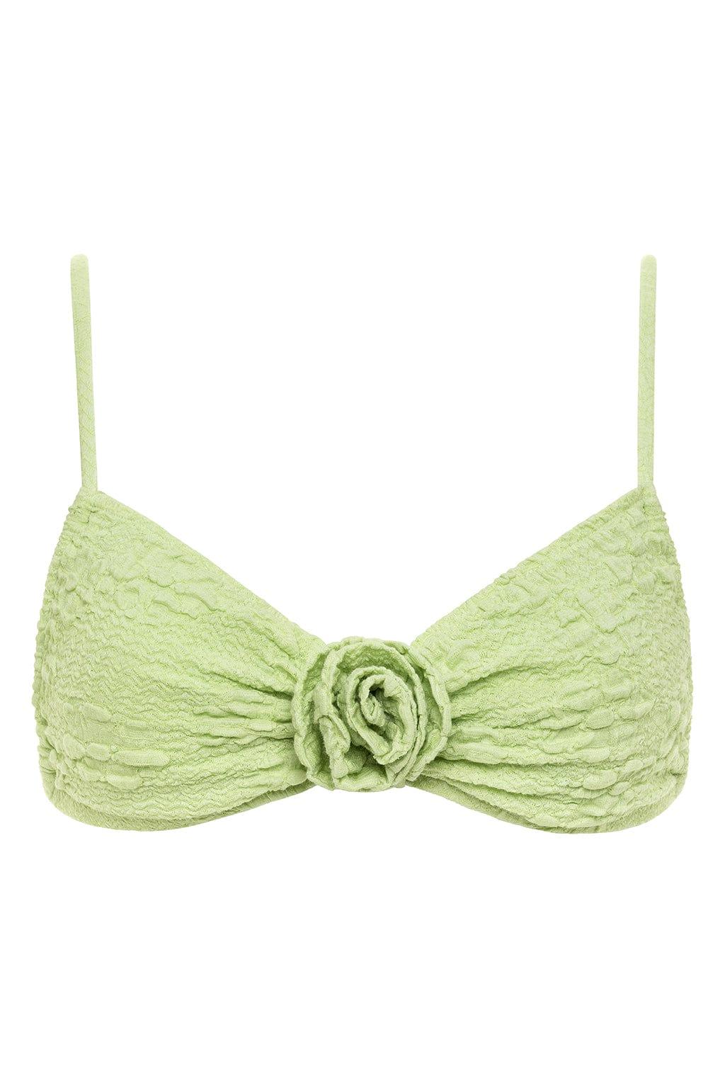 Light green textured bikini top with thin straps and rose-shaped center detail at the center front.