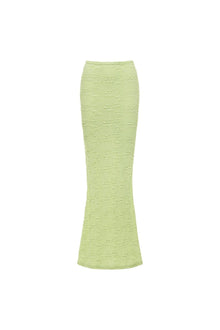 Lime green textured maxi skirt with floral embossed pattern and fitted silhouette.
