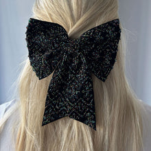 Black Hair Bow with Multi-Colored Beading Styled in Model's Hair