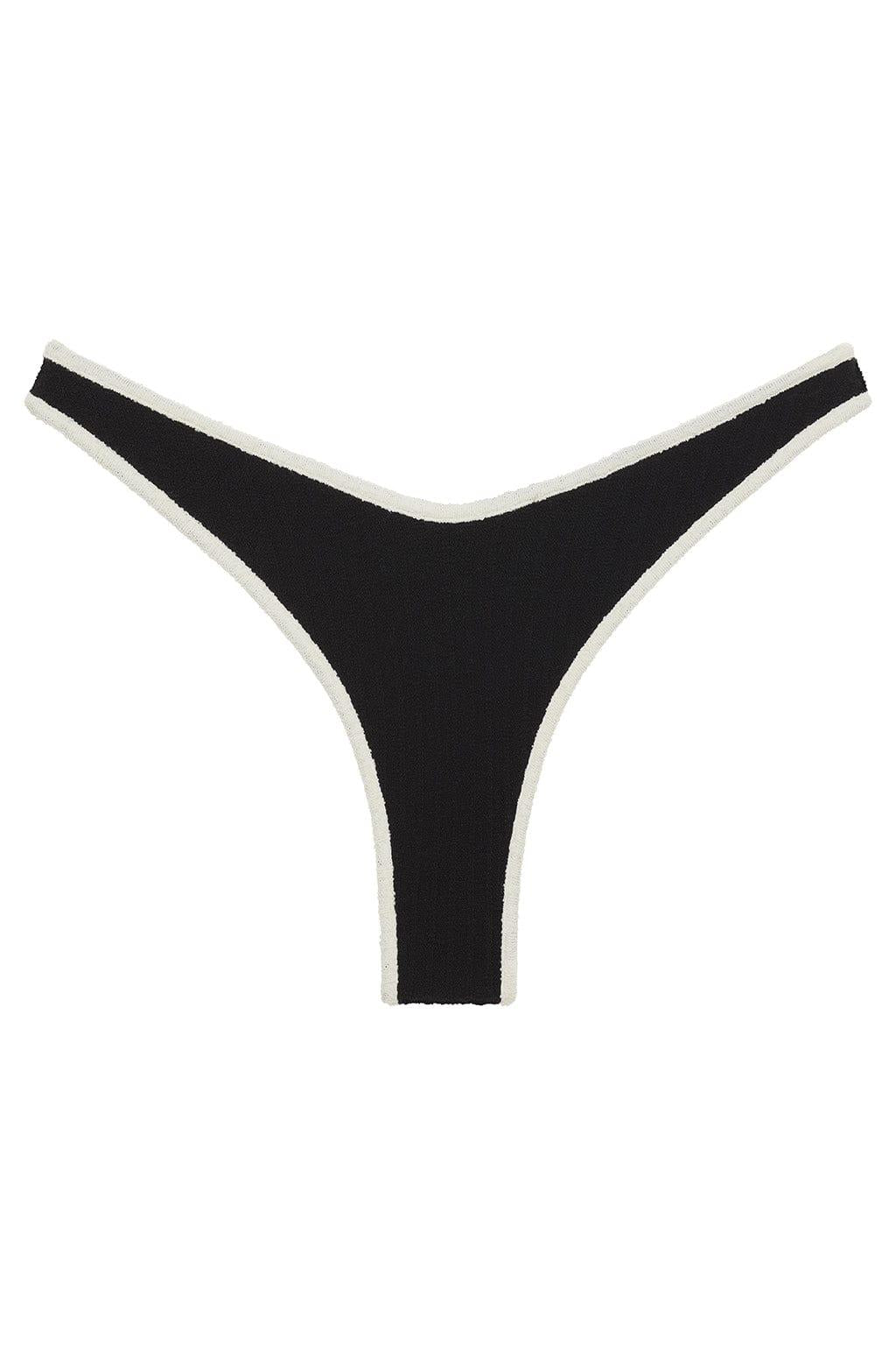 Black thong bikini bottom with cream-colored ribbed binding along the edges.