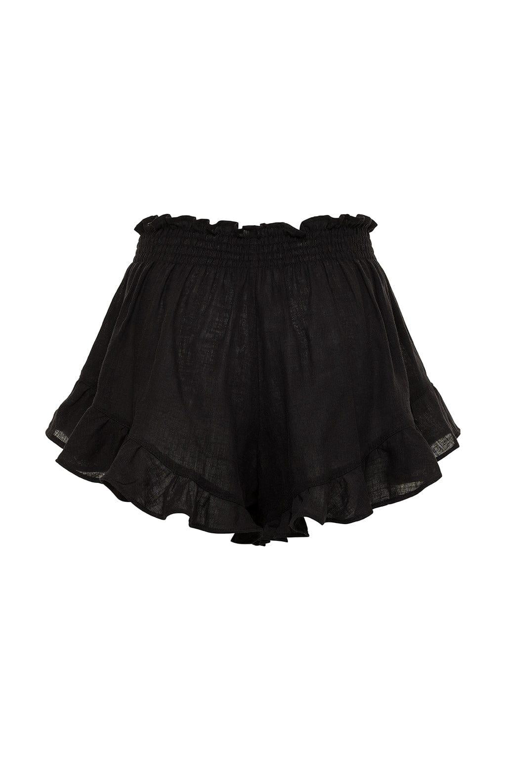 Black short with smocked waistband and ruffled off-shoulder neckline in textured fabric.