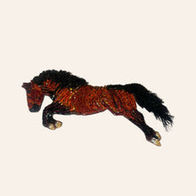 Brown and Black Beaded Horse Brooch On Tan Background