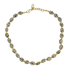 Brown and Black Stone and Yellow Bead Strand Necklace on Flat White Background