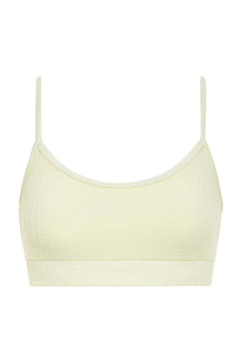 Cream ribbed sport top with thin shoulder straps and scoop neckline.