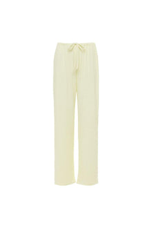 Cream-colored ribbed pants with drawstring waistband and straight leg silhouette.