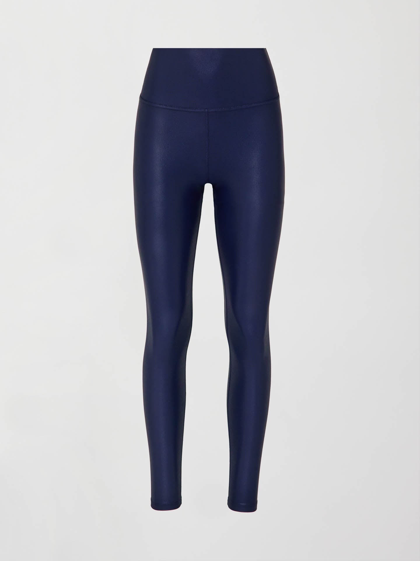 A pair of navy high waisted performance leggings in a liquidy-shine finish that hit at the ankle against a white background.