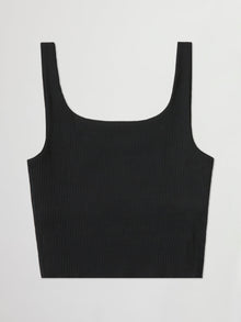 Flat lay of ribbed black cropped tank top on white background.