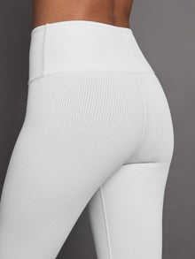 Close-up of Ribbed 7/8 leggings in white showing high-rise waistband and textured detail.