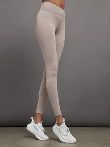 Side view of Heather Melt wrap legging in heather oatmeal.