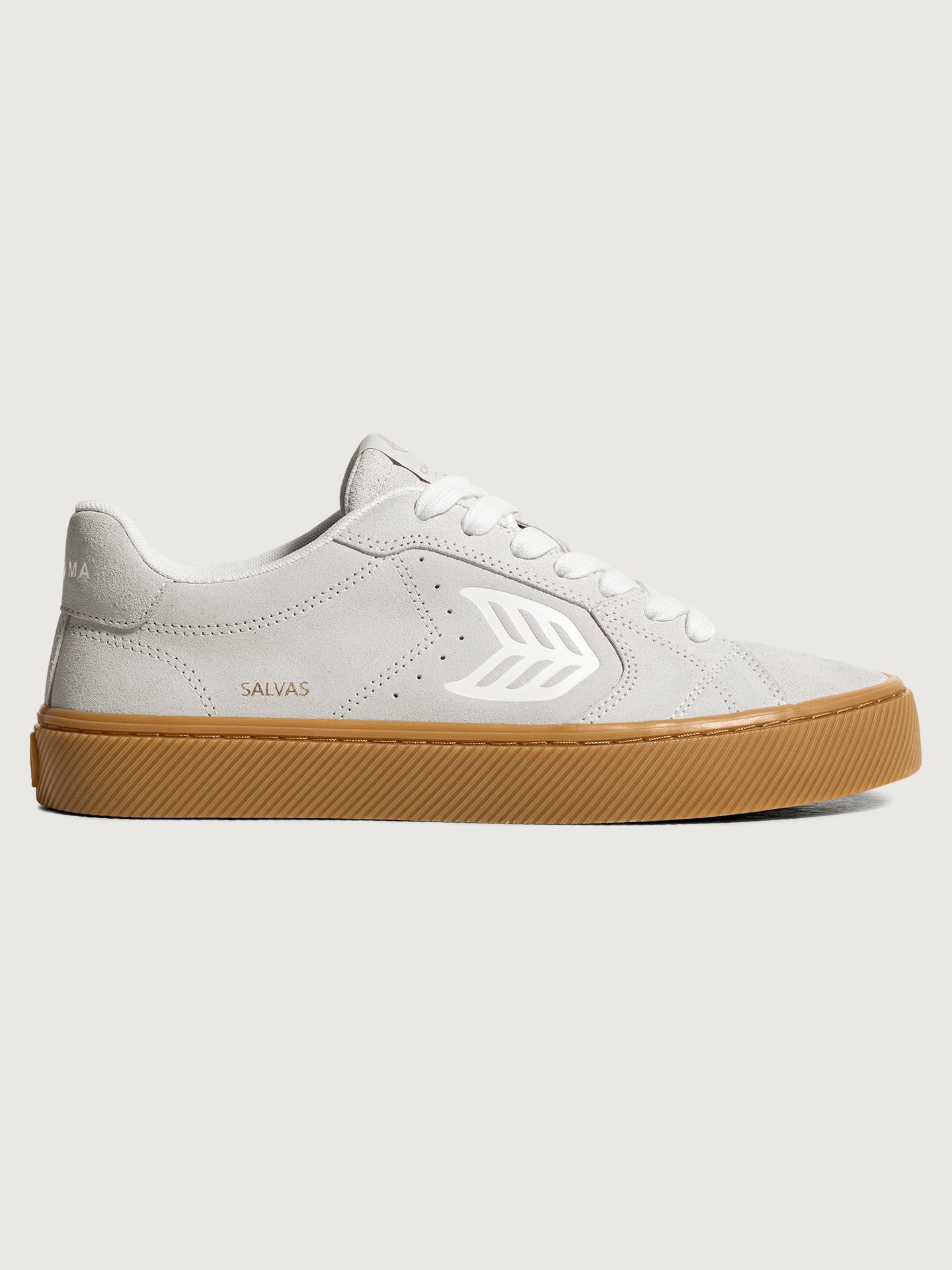 Suede white/light gray sneaker with light brown sole. 