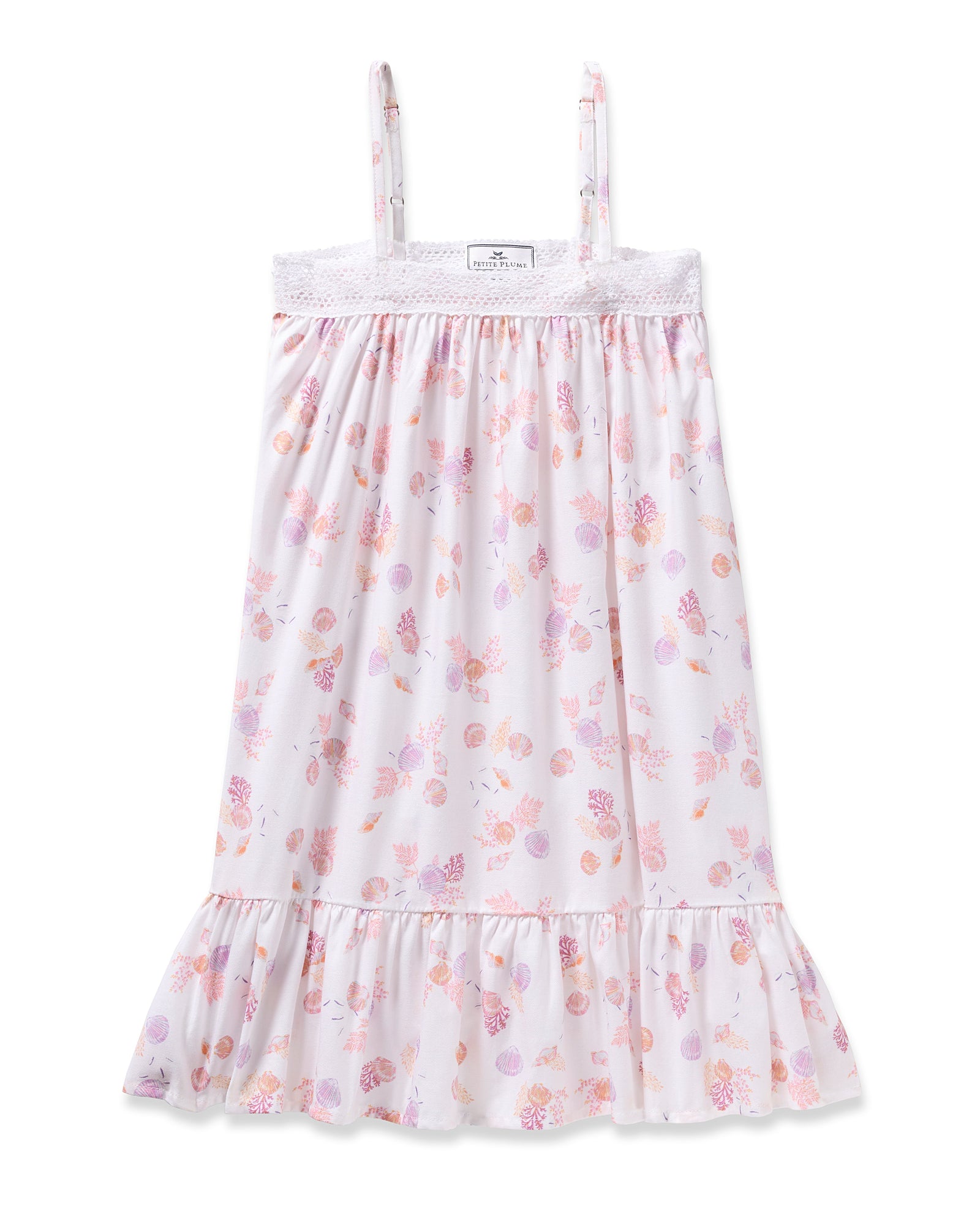 Enjoy the elegance of Petite Plumes Girls Twill Lily Nightgown in Seashell Splendor—a white sleeveless dress boasting pink and purple floral and fruit patterns, yarn-dyed cotton, a lacy trim top, and a ruffled hem for luxurious sleep.