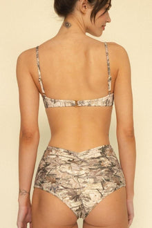 Camouflage patterned bikini bottom with high-waisted cut and wrinkled texture detail.