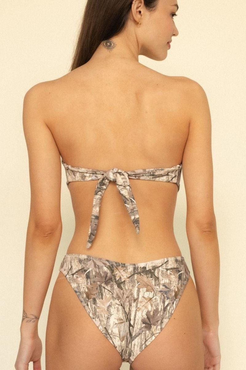 Camo print bandeau bikini top with tie closure at back, shown from behind on model.