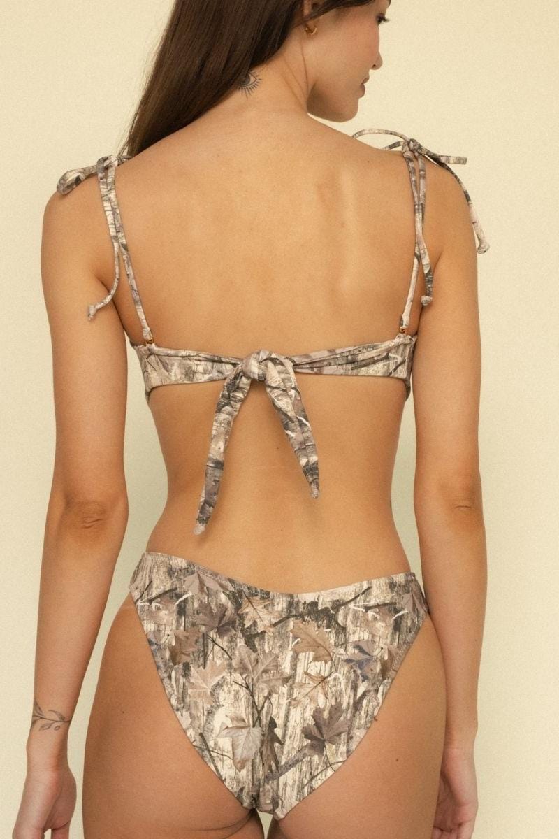 Camouflage bandeau bikini top with tie-back straps and matching bottoms in beige and gray tones.