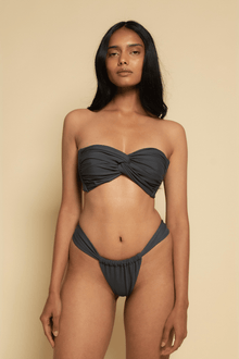 Charcoal strapless bikini top with twisted center detail and matching bottom.