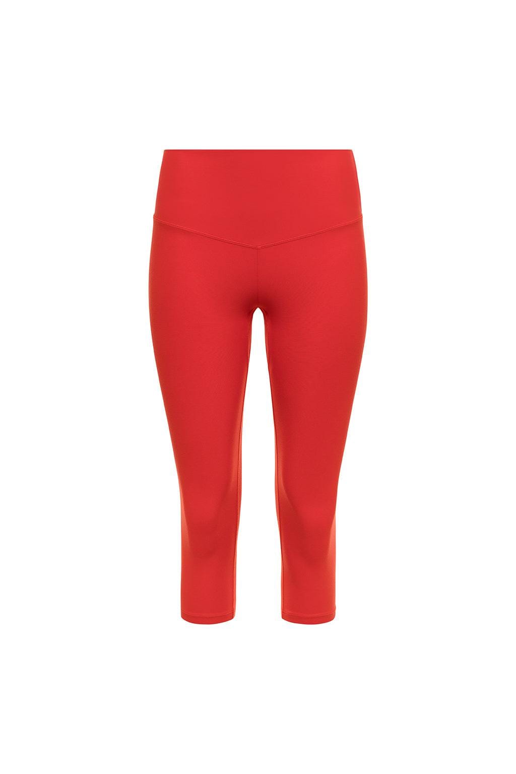 Red capri legging with high waistband and cropped length ending below the knee.