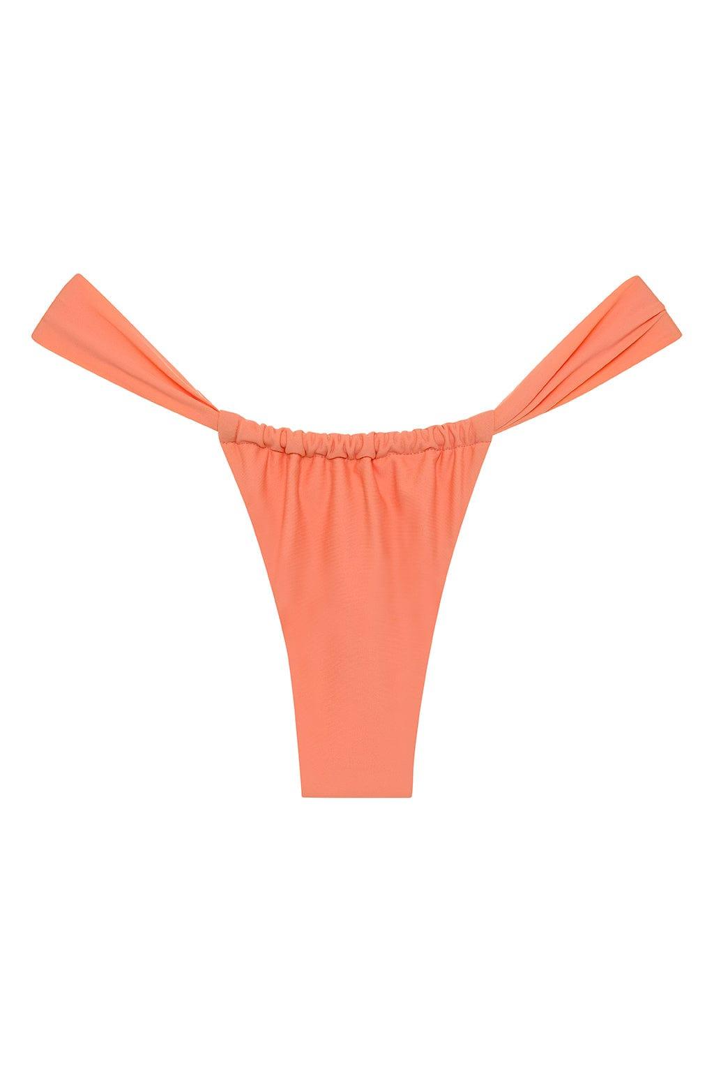 Coral bikini bottom with ruched waistband and wide tie-side straps.