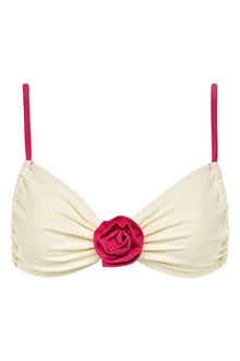 Cream bikini top with raspberry pink straps and a rose-shaped center detail.