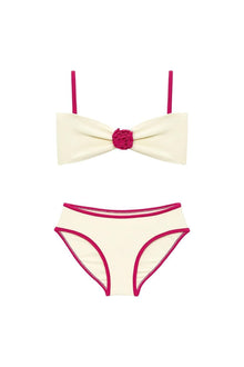 Cream and raspberry bikini set with bow-tie top featuring rosette center detail and matching bottoms with contrasting binding