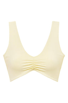 Cream ribbed bikini top with ruched center detail and wide shoulder straps.