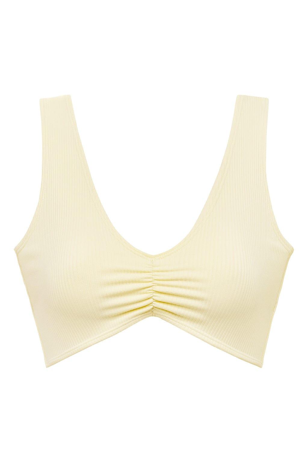 Cream ribbed bikini top with ruched center detail and wide shoulder straps.