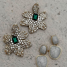 Crystal Double Drop Earrings and Clear and Emerald Crystal Statement Flower Earrings on Marble Background