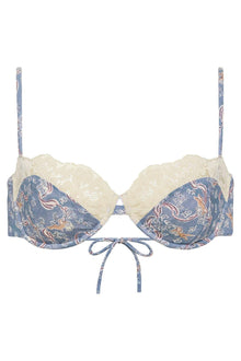 Blue patterned bikini top with cream lace trim, tie-front closure, and adjustable shoulder straps.