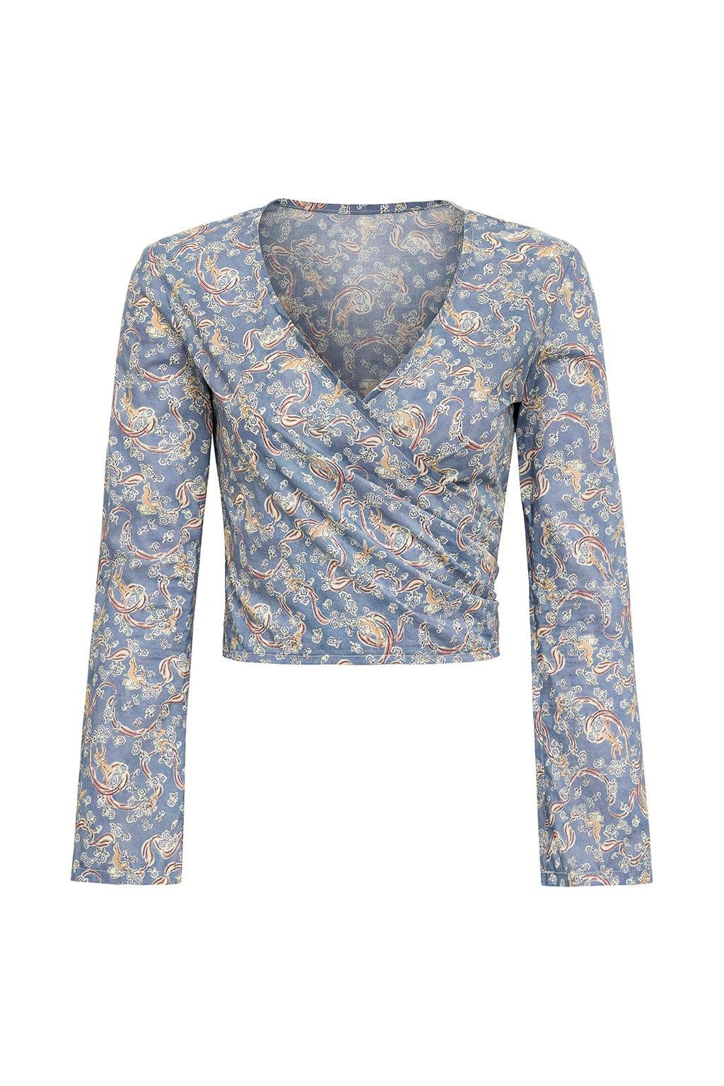 Blue wrap top with gold and rust paisley print, long sleeves, and V-neckline.