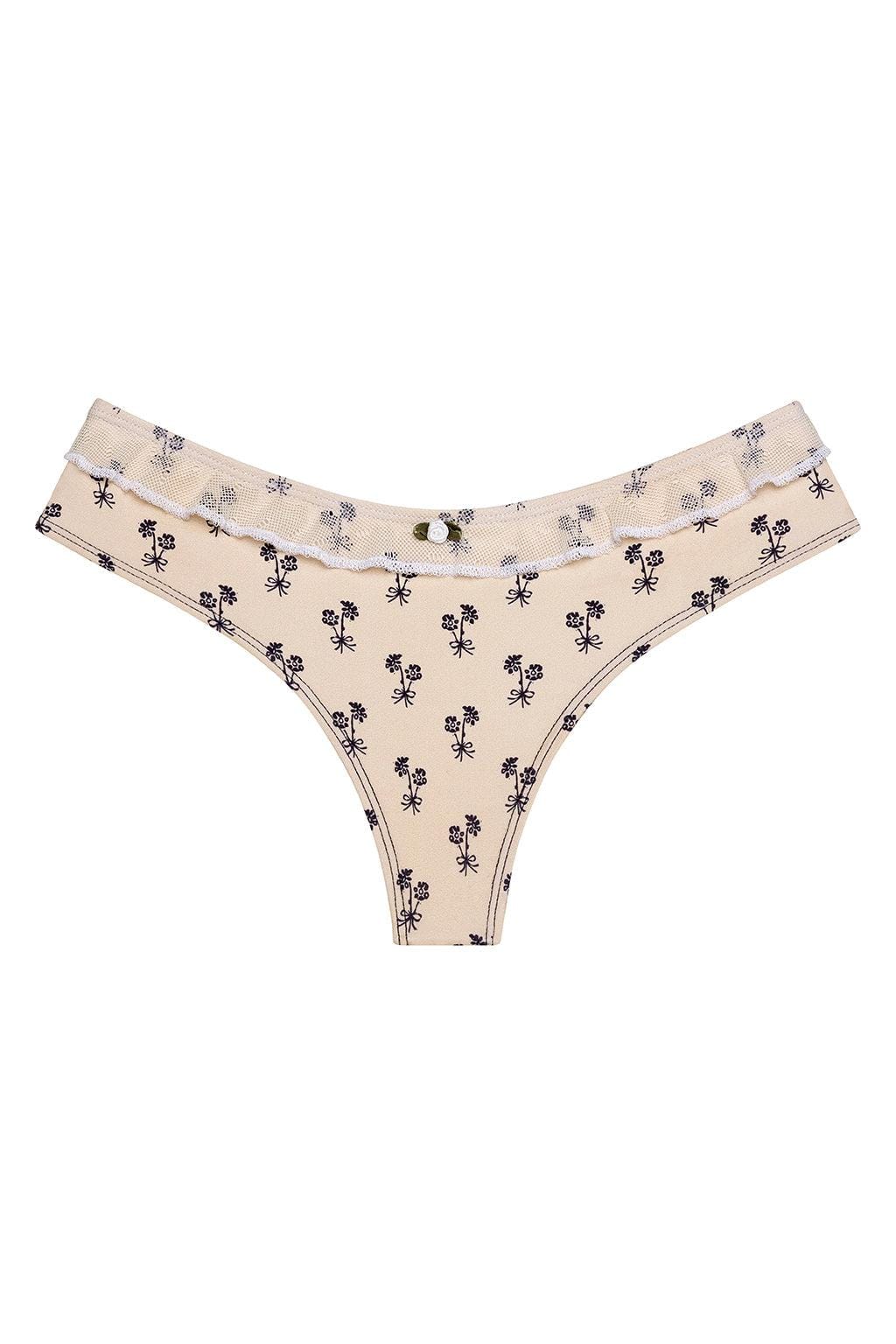 Cream bikini bottom with black floral print and ruffled edges at the waistband.