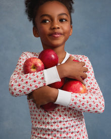 Kid's Pima Snug Fit Pajama Set in Autumn Orchards: two-piece set with long sleeves and pants, featuring a red flower pattern on a white background with solid white cuffs and neckline.