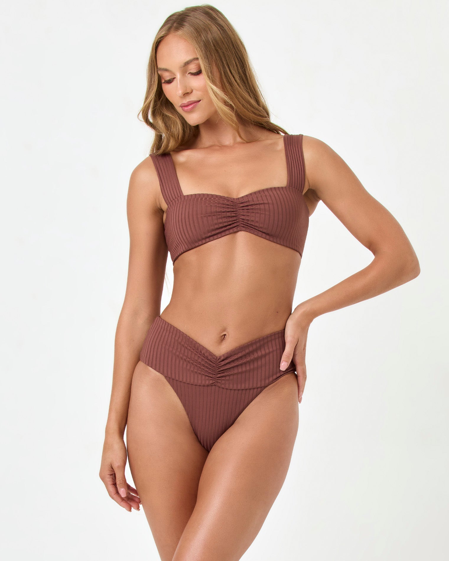 Cafe | Badge:Eco-Friendly_#B2AC88_#ffffff'
Woman wearing a brown bikini on a white background