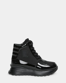 The CHELSA - L224505 Black by Rudsak is a women’s sneaker boot in black patent leather with a chunky sole, lace-up front, waterproof zipper, ribbed heel, and subtle side R logo. Glossy and weather-resistant for stylish wear.