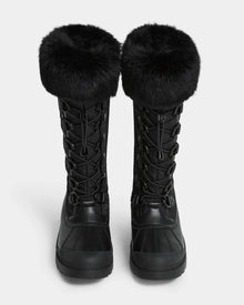 The Rudsak WINDY - L224507 Black women's winter boots feature thick faux fur trim cuffs and lace-up fronts, shown side by side on a white background for cold-weather comfort.