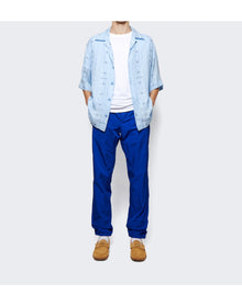 Givenchy | Men | 4g Embroidered Gar t Dye Trackpants | Blue