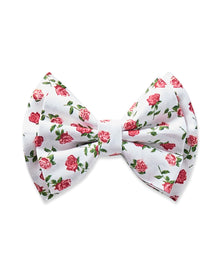 The Girls Twill Hair Bows in Petite Petals by Petite Plume are charming white accessories featuring a floral pattern of small pink roses and green leaves, perfect for adding elegance to pajamas or sophistication to girls hair.