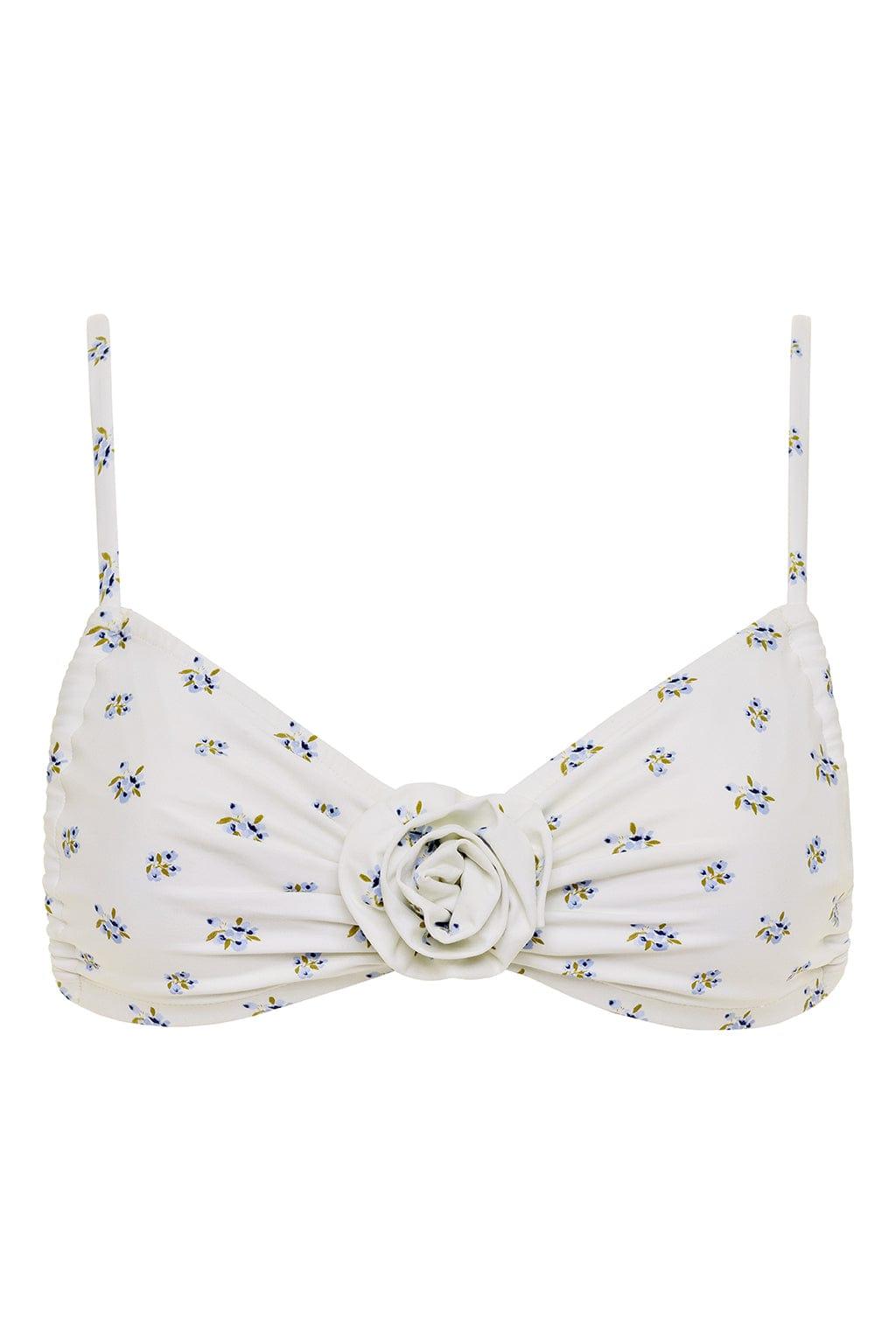 White bikini top with small blue and yellow floral print and center rosette detail.