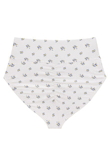 White bikini bottom with small blue and yellow floral print throughout and high-rise waistband.
